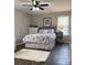 Comfortable bedroom with floral bedding, ceiling fan, and stylish bedside table decor at 715 Cody Ct, Fort Mill, SC 29715