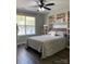 Comfortable bedroom featuring a ceiling fan, large window, and built-in bookshelves at 715 Cody Ct, Fort Mill, SC 29715