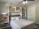 Cozy bedroom offering ample storage with built-in shelving around the comfortable bed at 715 Cody Ct, Fort Mill, SC 29715