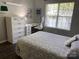 Inviting bedroom with natural light, a functional desk area, and neutral decor at 715 Cody Ct, Fort Mill, SC 29715