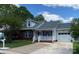 Charming single-story home features a brick and siding exterior, attached garage, and inviting front porch at 715 Cody Ct, Fort Mill, SC 29715
