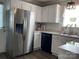 Spacious kitchen boasts stainless steel refrigerator and ample white cabinet storage at 715 Cody Ct, Fort Mill, SC 29715