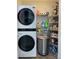 Well-organized laundry area with modern washer/dryer and shelving for storage at 715 Cody Ct, Fort Mill, SC 29715