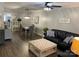 Bright and airy living space with hardwood floors, neutral paint, and seamless access to the dining area at 715 Cody Ct, Fort Mill, SC 29715