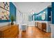 Bright bathroom featuring dual sinks, wood floors, standalone tub and a shower with glass surround at 740 Woodlawn Ave, Mount Holly, NC 28120