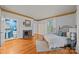 Spacious bedroom with a fireplace, large windows, and neutral decor, creating a cozy and inviting atmosphere at 740 Woodlawn Ave, Mount Holly, NC 28120