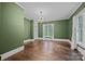 Spacious bedroom with hardwood floors, large window, and neutral green walls to create a relaxing atmosphere at 740 Woodlawn Ave, Mount Holly, NC 28120
