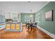 Charming dining area with a round table set near the kitchen island at 740 Woodlawn Ave, Mount Holly, NC 28120