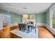 Elegant dining room with a stunning chandelier and a view of the fireplace at 740 Woodlawn Ave, Mount Holly, NC 28120