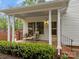 Inviting front porch with seating, offering a relaxing outdoor space at 740 Woodlawn Ave, Mount Holly, NC 28120