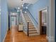 Spacious hallway with staircase, showcasing classic architectural details and ample natural light at 740 Woodlawn Ave, Mount Holly, NC 28120