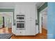 Bright kitchen with stainless KitchenAid appliances and custom white cabinetry for a modern, functional design at 740 Woodlawn Ave, Mount Holly, NC 28120