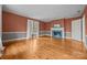 Open living room with a fireplace feature, large window for natural light, and ample space at 740 Woodlawn Ave, Mount Holly, NC 28120