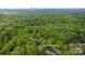 An aerial view showing the property at 7514 Pewter Ln with lush tree coverage close to Charlotte at 7514 Pewter Ln, Charlotte, NC 28270