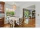 Inviting dining area with a large window offering beautiful backyard views at 7514 Pewter Ln, Charlotte, NC 28270