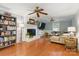 Open living room with hardwood floors, fireplace and a comfortable layout at 7514 Pewter Ln, Charlotte, NC 28270
