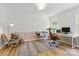 Bright office space features a desk and chair with natural light and stylish decor at 7514 Pewter Ln, Charlotte, NC 28270
