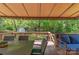 Covered patio area with outdoor seating, creating a comfortable extension of the living space at 7514 Pewter Ln, Charlotte, NC 28270