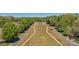 Scenic aerial view of a neighborhood entrance with a wide green median and tree-lined streets at 8100 Skye Knoll Dr # 144, Waxhaw, NC 28173
