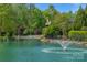 Scenic pond view with water feature, lush landscaping, and walking path at 8100 Skye Knoll Dr # 144, Waxhaw, NC 28173