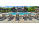 Resort-style pool area with lounge chairs, tables, and a backdrop of beautifully designed buildings at 8100 Skye Knoll Dr # 144, Waxhaw, NC 28173