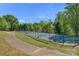 Community tennis courts accessible from a walking path at 8100 Skye Knoll Dr # 144, Waxhaw, NC 28173