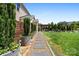 Beautiful backyard with a walkway, manicured lawn, and an inviting outdoor living space at 9611 Pensive Ln, Waxhaw, NC 28173
