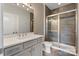 Modern bathroom featuring a glass enclosed shower, vanity, and updated fixtures at 9611 Pensive Ln, Waxhaw, NC 28173