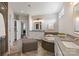 Bright bathroom featuring a corner soaking tub, white cabinets and a glass shower at 9611 Pensive Ln, Waxhaw, NC 28173
