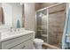 Modern bathroom featuring sleek vanity and frameless glass shower with tiled walls at 9611 Pensive Ln, Waxhaw, NC 28173
