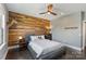 Charming bedroom boasts a wooden accent wall and an interesting mounted deer head at 9611 Pensive Ln, Waxhaw, NC 28173