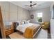 A serene bedroom featuring paneled accent wall and a comfortable reading chair at 9611 Pensive Ln, Waxhaw, NC 28173