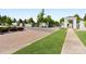Elegant gated community entrance with brick-paved drive and meticulously maintained landscaping at 9611 Pensive Ln, Waxhaw, NC 28173
