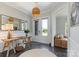 Bright foyer featuring a pendant light fixture, accent table, and hardwood floors at 9611 Pensive Ln, Waxhaw, NC 28173
