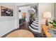 Inviting home foyer with a staircase, hardwood floors, and neutral decor at 9611 Pensive Ln, Waxhaw, NC 28173
