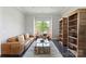 Cozy living room with a large window, comfortable seating, and stylish decor at 9611 Pensive Ln, Waxhaw, NC 28173
