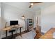 Functional office space includes a wooden desk and a unique industrial-style dresser at 9611 Pensive Ln, Waxhaw, NC 28173