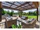 Relaxing outdoor patio area features comfortable seating and a serene view of the pond at 9611 Pensive Ln, Waxhaw, NC 28173