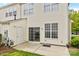 View of the back patio with sliding glass door and a door to the outside, showcasing outdoor living at 1001 Woodglen Ln, Matthews, NC 28104