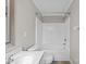 Bathroom showcasing a combination tub and shower with white tile surround and a single sink vanity at 1001 Woodglen Ln, Matthews, NC 28104