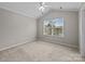 Bedroom with vaulted ceiling and large window at 1001 Woodglen Ln, Matthews, NC 28104