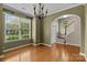 Spacious dining room with hardwood floors and decorative lighting at 1001 Woodglen Ln, Matthews, NC 28104