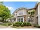 Charming two-story home featuring stone accents and manicured landscaping at 1001 Woodglen Ln, Matthews, NC 28104