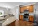 Well-equipped kitchen with stainless steel appliances and granite countertops at 1001 Woodglen Ln, Matthews, NC 28104