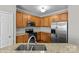 Spacious kitchen featuring wooden cabinets and modern appliances at 1001 Woodglen Ln, Matthews, NC 28104