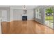 Spacious living room with a fireplace and sliding glass doors at 1001 Woodglen Ln, Matthews, NC 28104