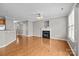 Bright living room featuring a fireplace and hardwood floors at 1001 Woodglen Ln, Matthews, NC 28104