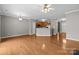 Open-concept living room flowing into kitchen area at 1001 Woodglen Ln, Matthews, NC 28104
