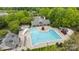 An aerial view of a community pool that features several seating areas, as well as wading pools at 1001 Woodglen Ln, Matthews, NC 28104