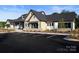 Beautiful building exterior with stone accents, neutral colors, and a well-maintained parking lot at 1003 Idyllic Ln, Waxhaw, NC 28173